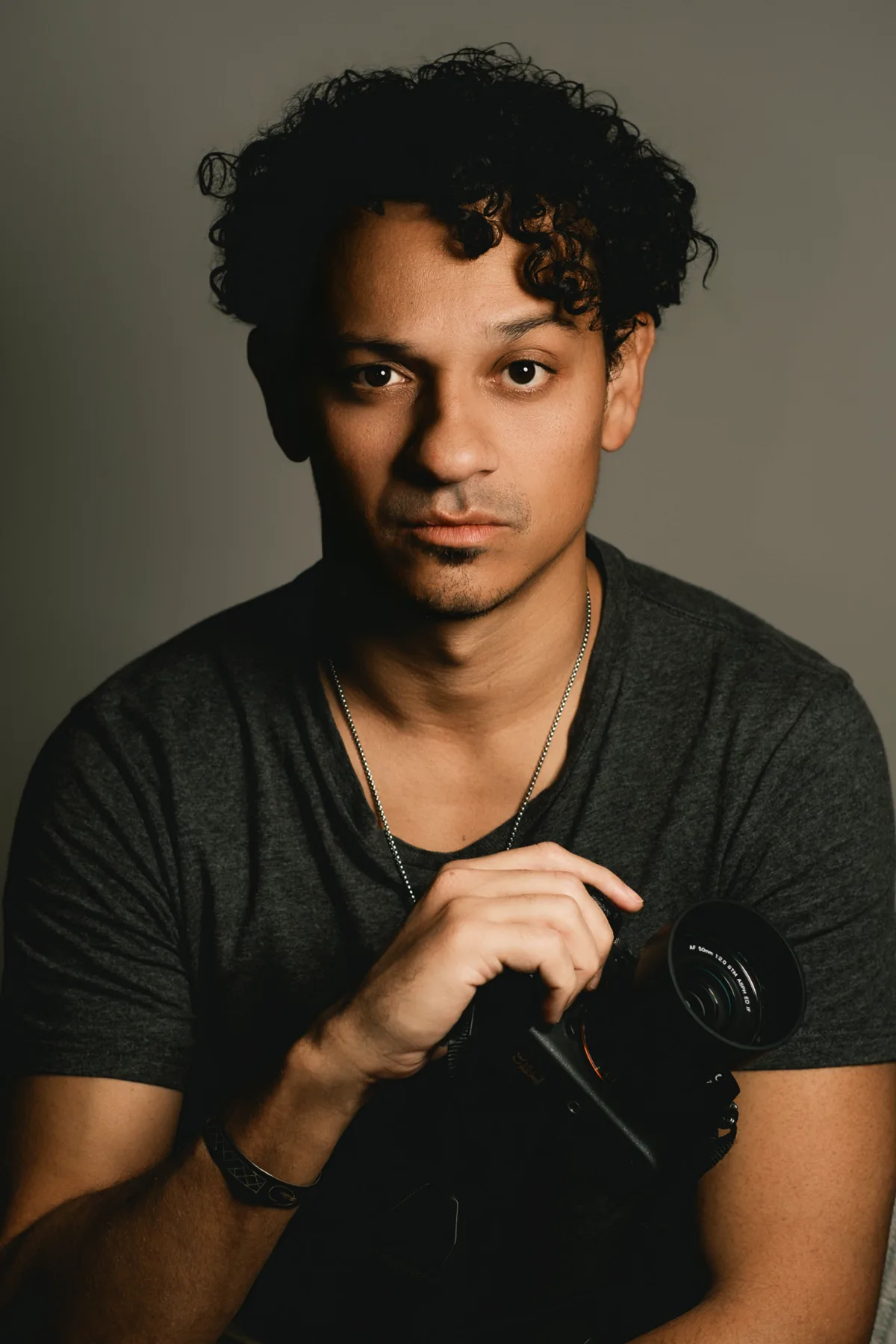 Claudio Rego — Professional Photographer in Malta Claudio Rego, professional photographer in Malta, holding his camera